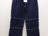 a close up of a pair of jeans hanging on a hanger