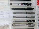 many different types of drill bits in a plastic case