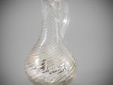 a glass vase that is sitting on a table