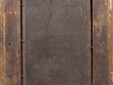 an old wooden frame with a sticker on it