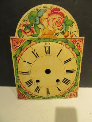 a clock that is sitting on a table in a room