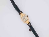 a close up of a wrist watch on a white surface