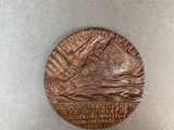 an image of a coin with a picture of a ship on it