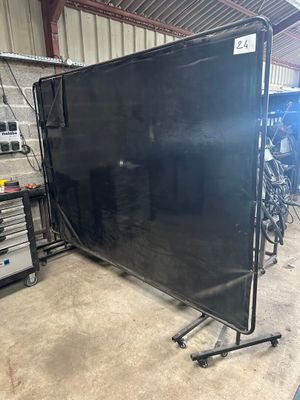 an image of a black screen in a garage with tools