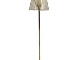 floor lamp in the shape of a lamp with a white shade on it
