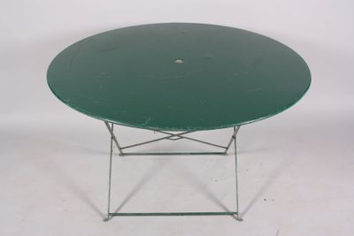 a green table with a metal base on a white background