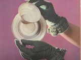 a picture of a woman holding a cup and saucer