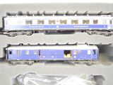 a blue and white train set in a plastic box