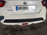 a white car that is parked in a parking lot