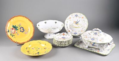 many different types of plates and bowls on the table