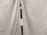 a baseball bat that is wrapped in plastic and sitting on a table