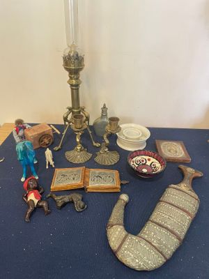 a table with a blue table cloth and various items on it