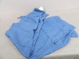 several pieces of blue cloth sitting on top of a table