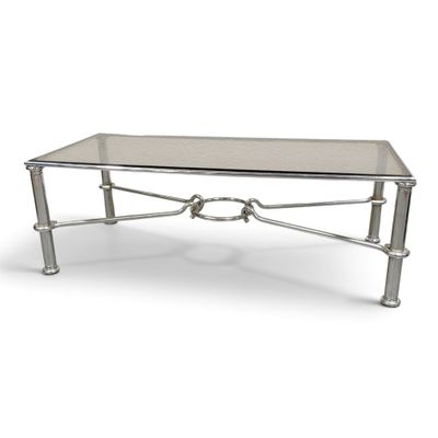 a silver coffee table with a glass top and metal legs