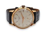 une photo d'une montre-bracelet en or montée sur un bracelet en cuir noir