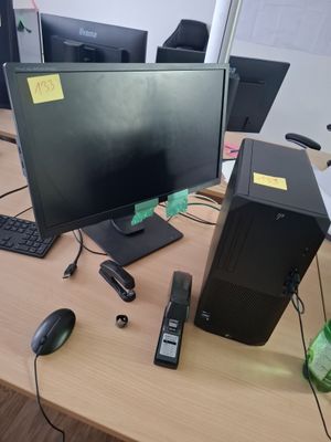 a desktop computer sitting on a desk next to a keyboard and mouse