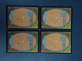 four cards with a picture of a baseball player in the middle of them