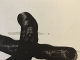 a black and white photo of a person laying on the ground