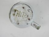a dirty cup with the word shr written on it