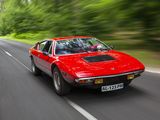 an image of a red sports car driving down the road