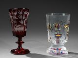 two wine glasses sitting next to each other on a table