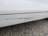 a close up of a car ' s bumper with a hole in the side