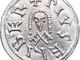 an old silver coin with the image of a horse on it