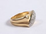 an image of a gold and diamond ring on a white surface