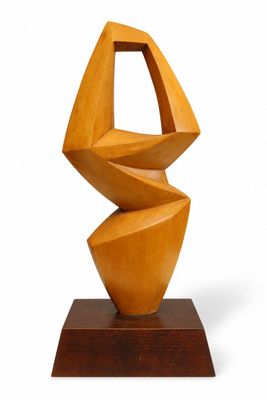 an image of a wooden sculpture on a wooden base