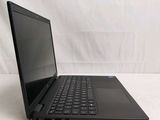 the laptop is sitting on a white surface with a black keyboard