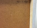 a close up of a picture of a painting on a table