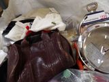 a brown purse and a brown handbag on a table