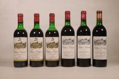 six bouteilles de vin sont alignées sur une table