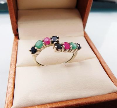 a ring that is sitting in a box on a table