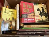 many books that are sitting in a box together