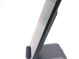 a cell phone that is sitting on top of a stand
