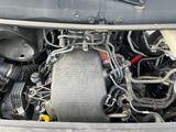 a close up of a car ' s engine with its hood open
