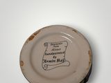 a small plate with writing on it on a table