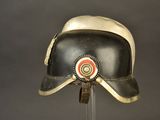 a helmet that is on a stand on a table
