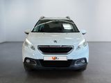 the front view of a white peugeot v - cross parked in a white room