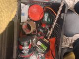 a person sitting on a bus with a suitcase full of stuff
