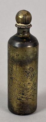 an image of a small brass bottle with a wooden lid