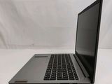 an open laptop computer sitting on top of a white table