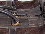 a close up of a brown bag with a handle