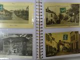 an open book with pictures of a street and buildings on it