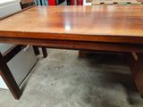 an image of a wooden table in a warehouse