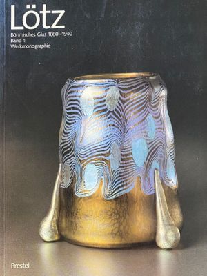 the cover of a book with a gold vase sitting on a table