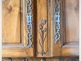 a large wooden door with a metal handle on it