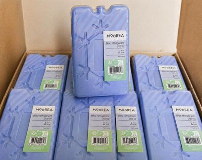 several boxes of blue soap are stacked on top of each other