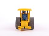 a yellow toy tractor with a man inside of it
